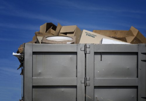 Workers sorting recyclable materials in a commercial setting
